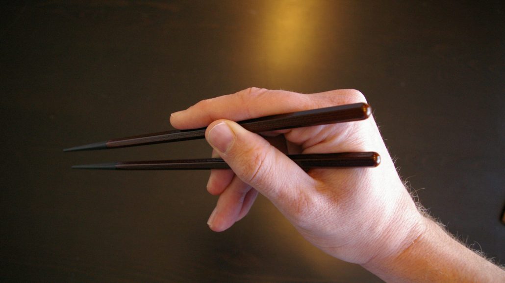 Holding a Pair of Chopsticks