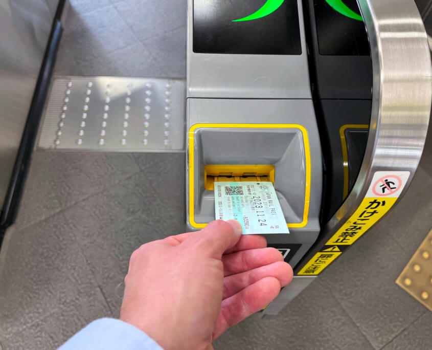 Slide your Japan Rail Pass into the Machine