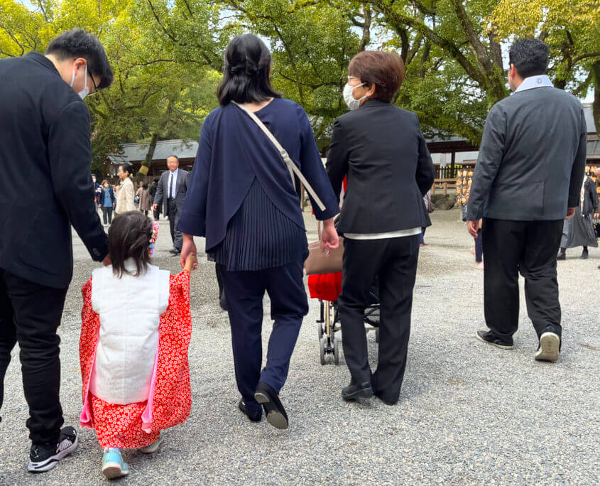 Girl in Kimono Walking with Parents