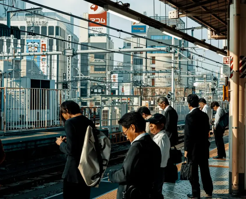 People Waiting on Train Platform in Japan