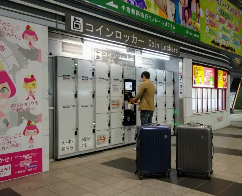 Man at Coin Lockers with Luggage