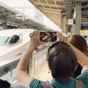 Tour Guest Taking Photo of Shinkansen
