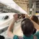 Tour Guest Taking Photo of Shinkansen