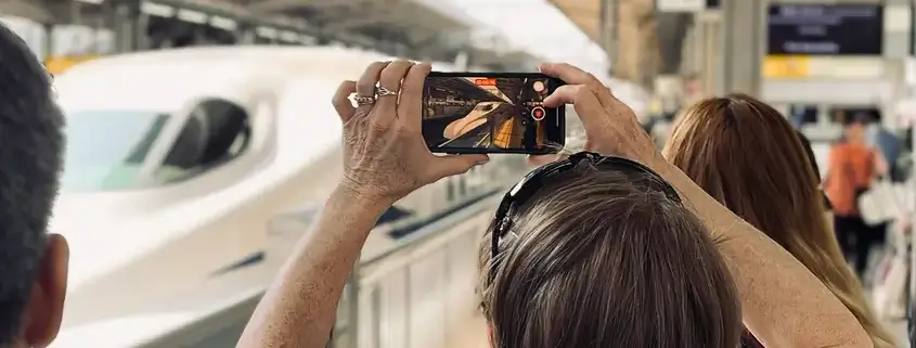 Tour Guest Taking Photo of Shinkansen