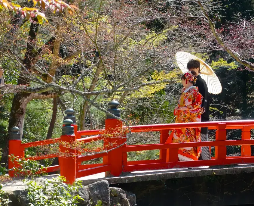 Wedding Couple on a Red Bridge in Miyajima, Japan