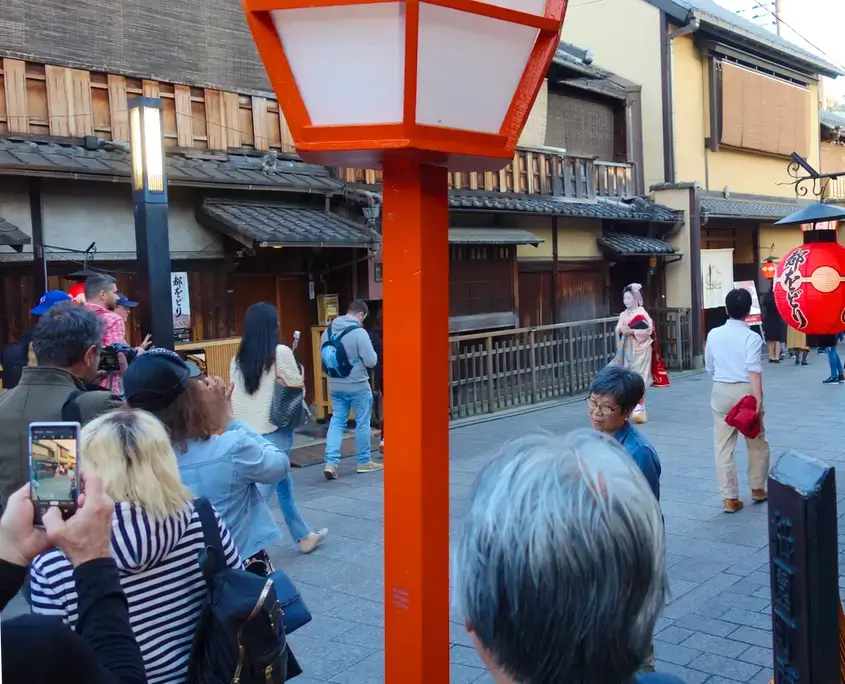 A Maiko Walking Through Gion on Her Way to an Appointment