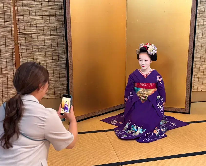 Taking a Photo of a Geisha in Kyoto